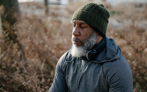 African American elderly man meditating