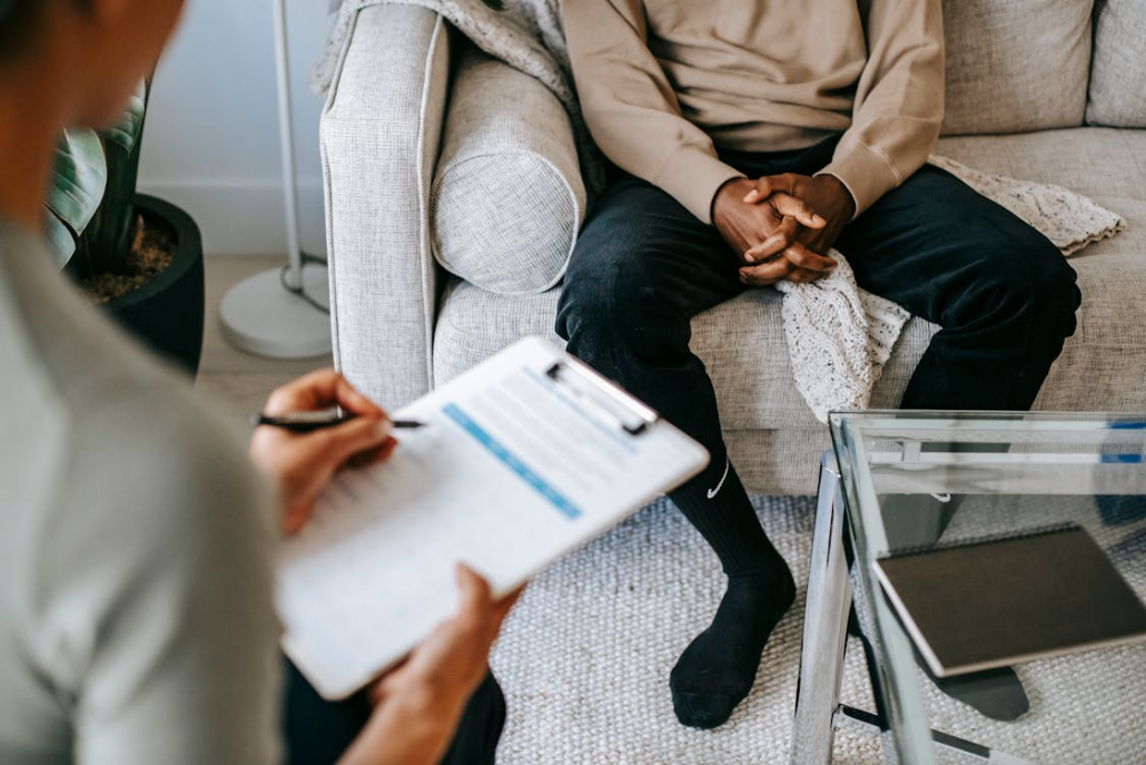 Man participating in a one-on-one therapy session focused on accountability and recovery.