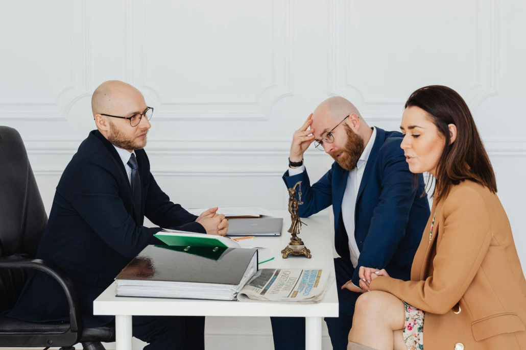 This photo shows a couple with a lawyer.