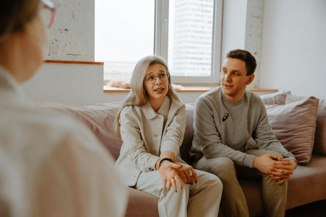 A couple holding hands at an addiction treatment center