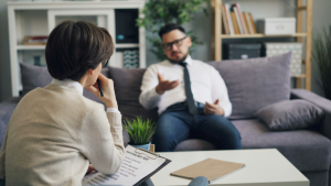A man talking to a counselor 